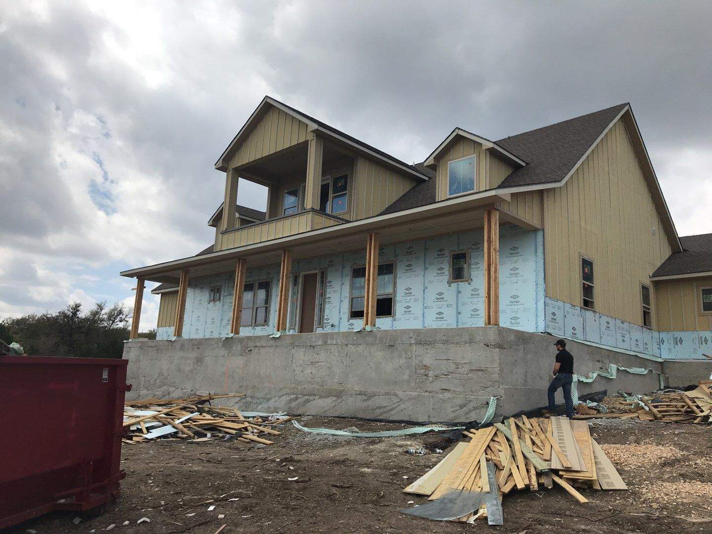 House under construction with exposed exterior and foundation