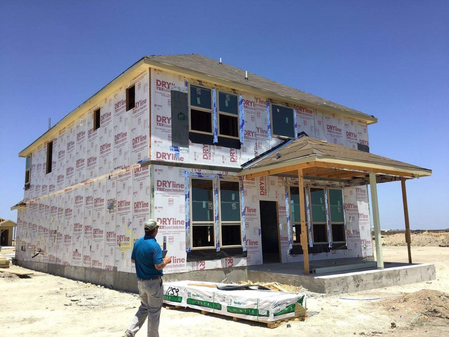 Field observer reviewing a home during construction